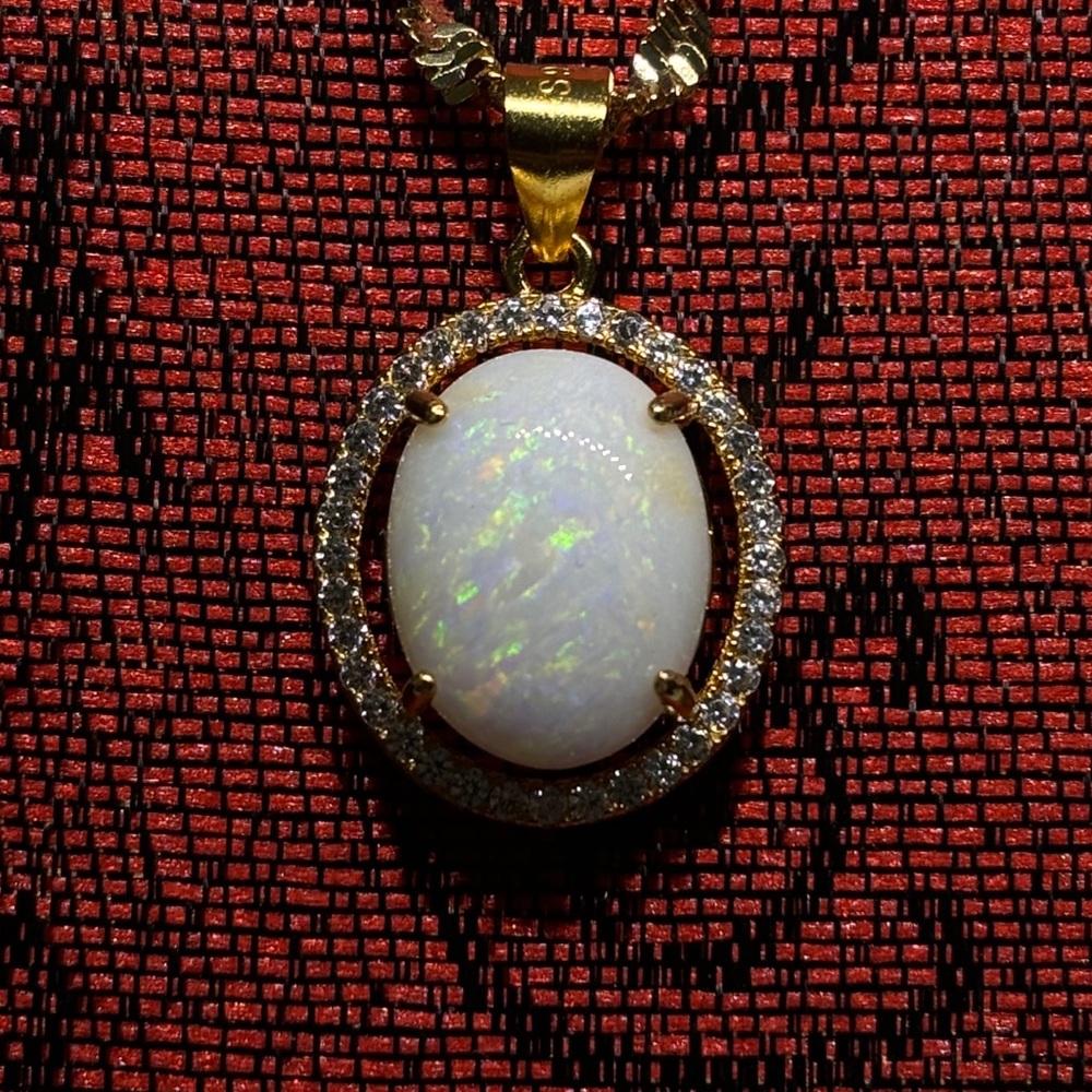 Majestic Rare Lambina Opal Set In an Upscale Setting Hung By A Singapore Chain